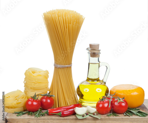 Italian cuisine. Pasta, a bottle of oil, tomatoes, spices