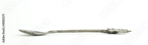 Metal and wood spoon in profile