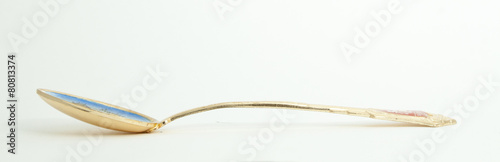 Metal and wood spoon in profile