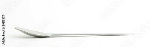 Metal and wood spoon in profile