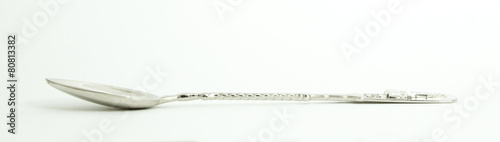 Metal and wood spoon in profile