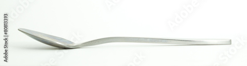 Metal and wood spoon in profile