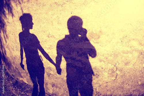 Vintage silhouette of two people holding hands