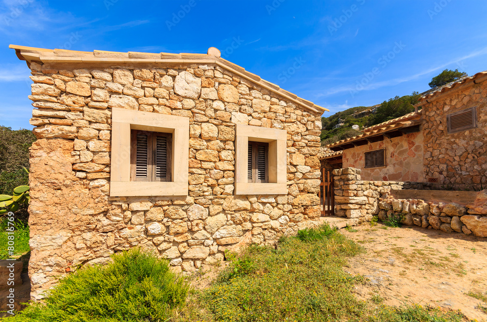Stone houses in Cala S'Almunia bay, Majorca island, Spain