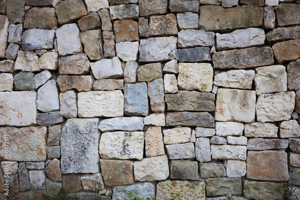 Obraz premium Stones stacked in a wall