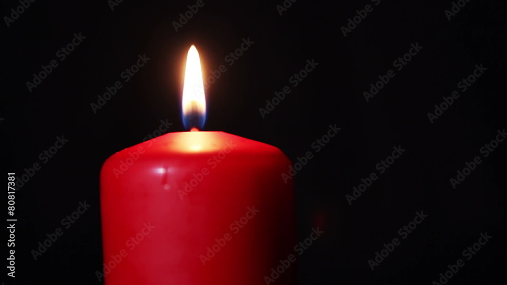 One candle burns brightly in the dark. HD 1080p video in motion One candle burns brightly in the dark. HD 1080p video in motion