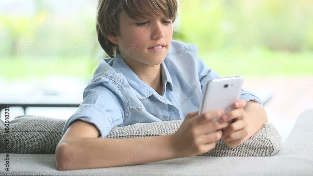 Teenage boy using smartphone