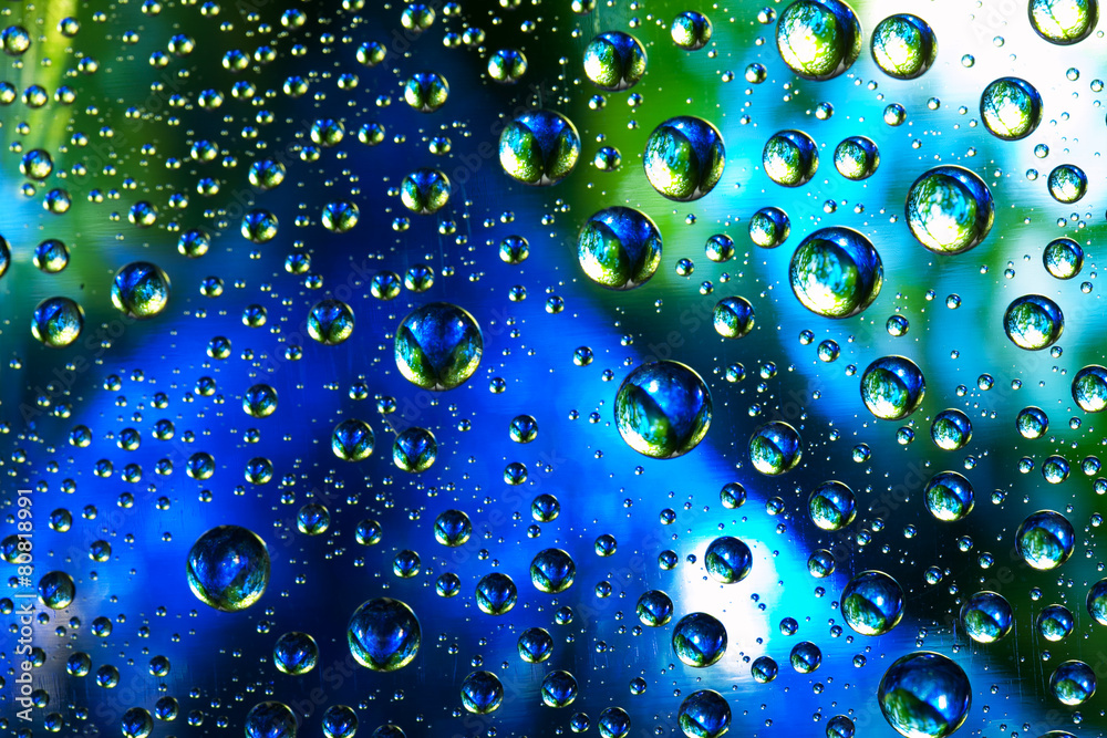 Abstract background texture drops of water and art light on glas
