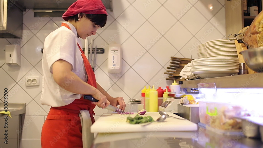 Woman chef sliced fresh vegetables and dill Woman chef sliced fresh vegetables and dill
