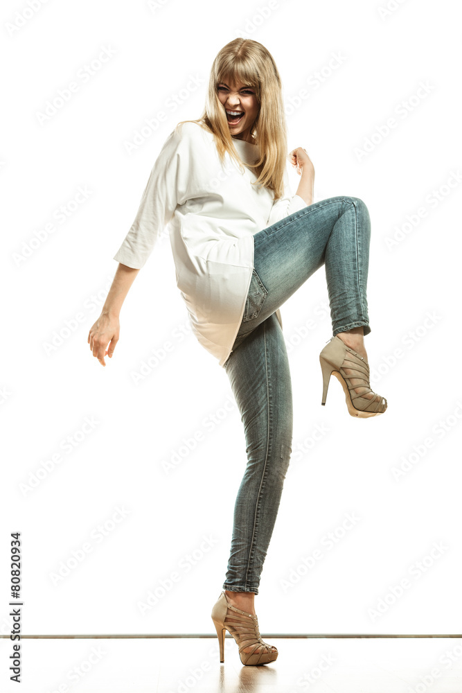 blonde fashion woman in white shirt denim pants