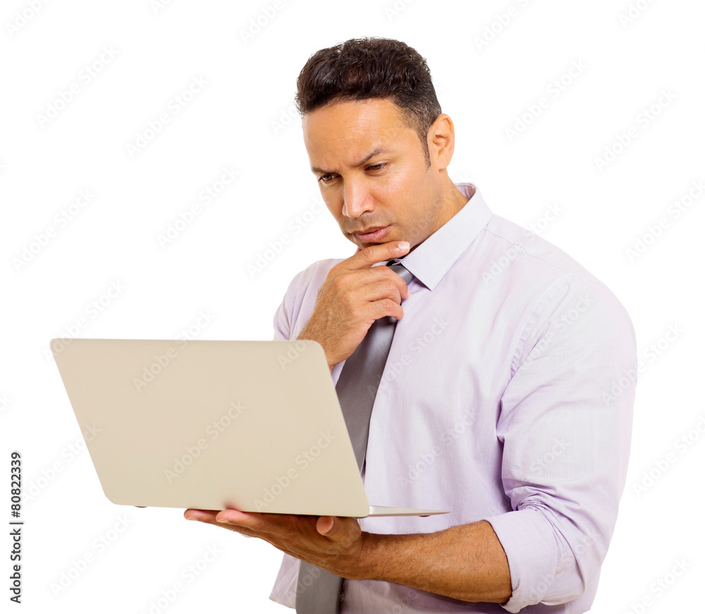 mid age businessman reading email on his laptop mid age businessman reading email on his laptop