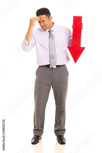 mature businessman holding arrow pointing down