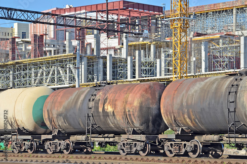 Railroad tank wagon and construction site background
