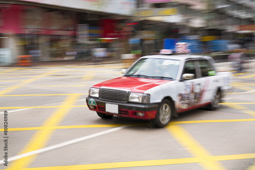Motion blurred Taxi in Hong Kong.