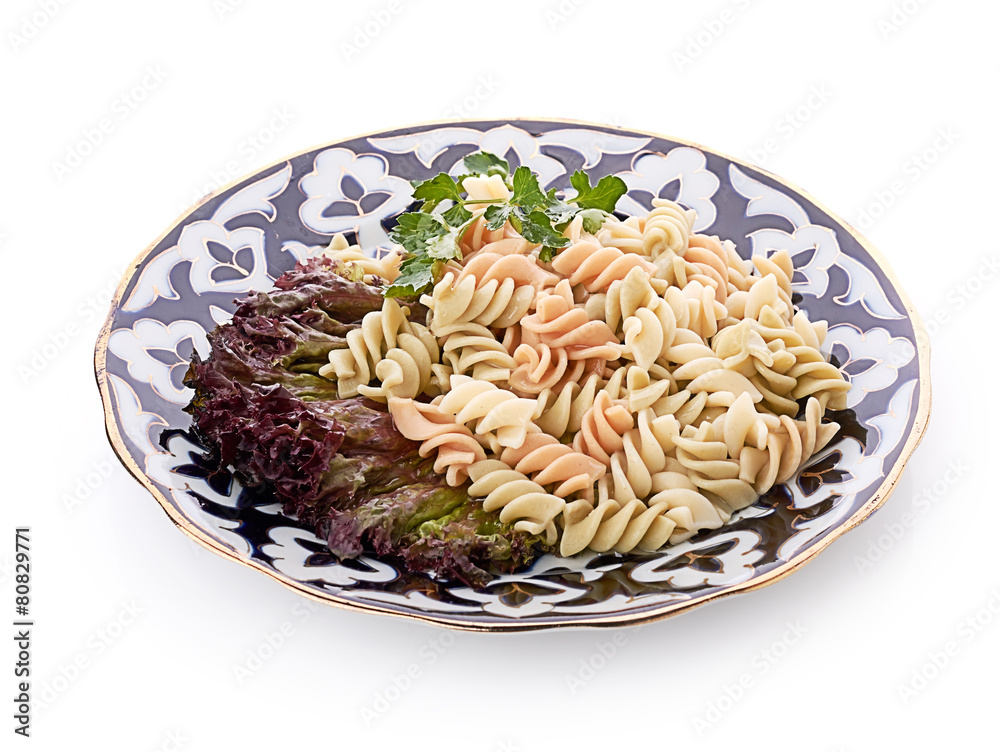 Penne pasta with sauce, cheese and basil, selective focus
