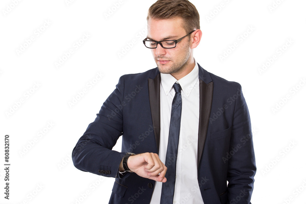 Young businessman look at his watches, isolated Young businessman look at his watches, isolated