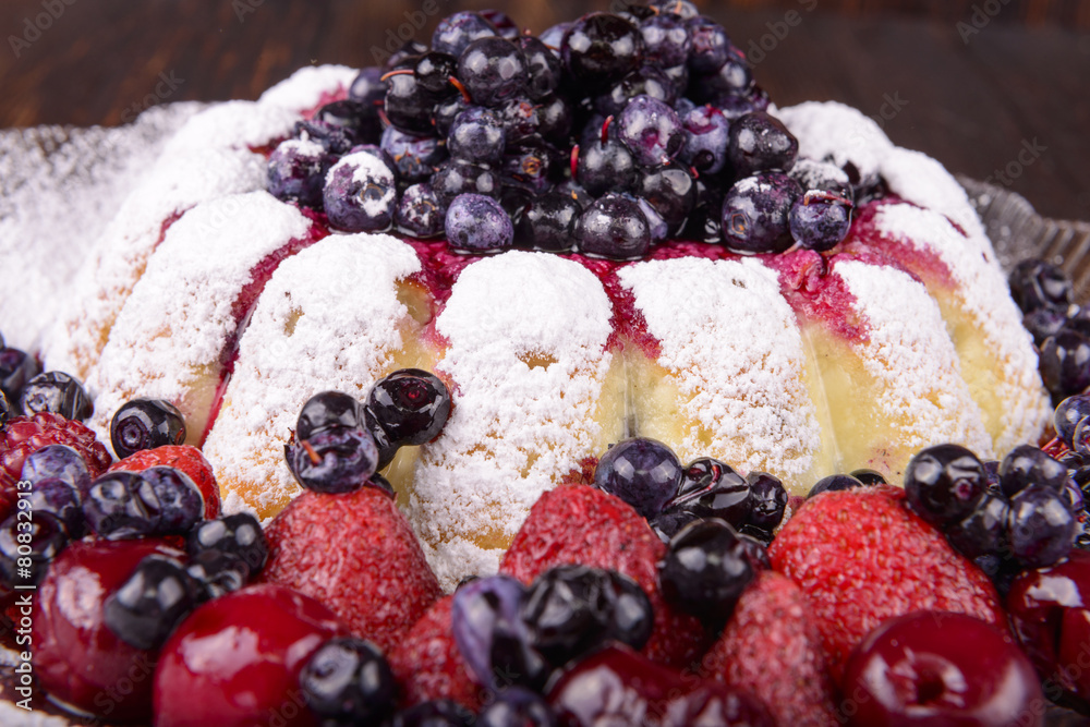 cheesecake with fruits on wooden background cheesecake with fruits on wooden background