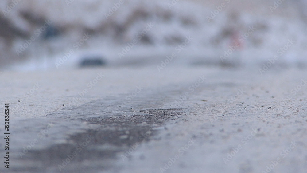 Cars passing bay on snowy road. Blurred video. Cars passing bay on snowy road. Blurred video.