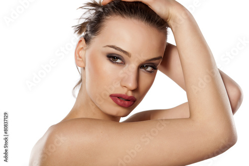 portrait of a beautiful young woman posing on a white background