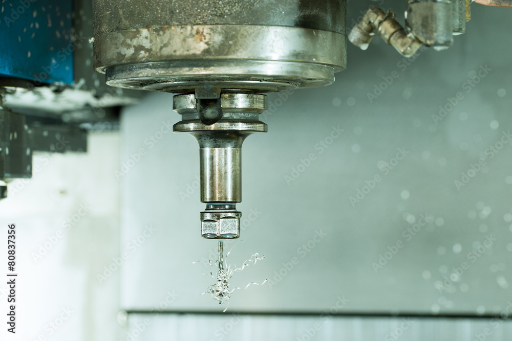 Side view on CNC milling machine drill with metal shaving Side view on CNC milling machine drill with metal shaving