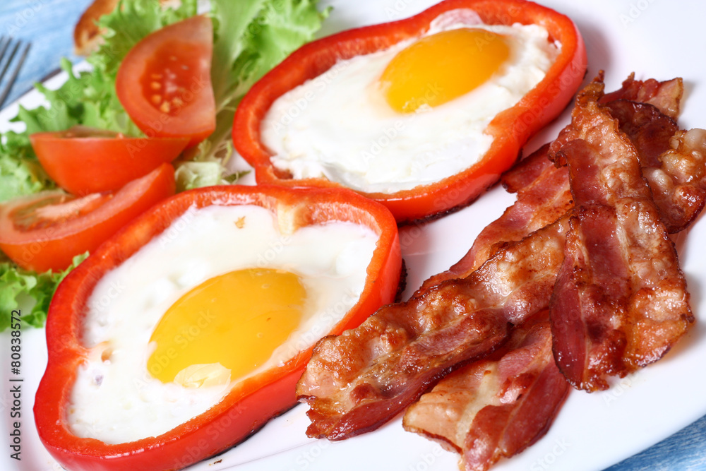 Breakfast fried eggs, bacon, tomatoes and lettuce Breakfast fried eggs, bacon, tomatoes and lettuce