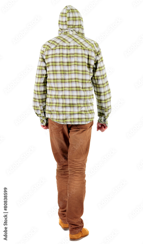 Back view of going guy in a plaid shirt with hood Back view of going guy in a plaid shirt with hood