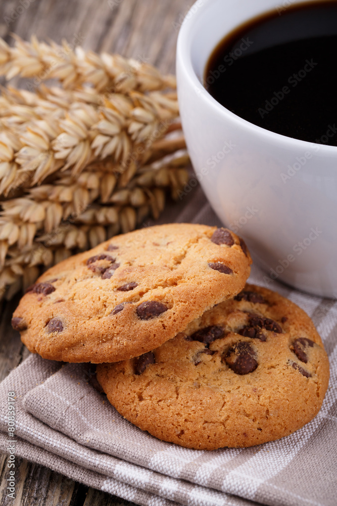 Cup of coffee with cookies and wheat on a wooden table. Cup of coffee with cookies and wheat on a wooden table.