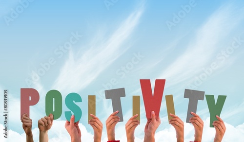 Composite image of hands showing positivity