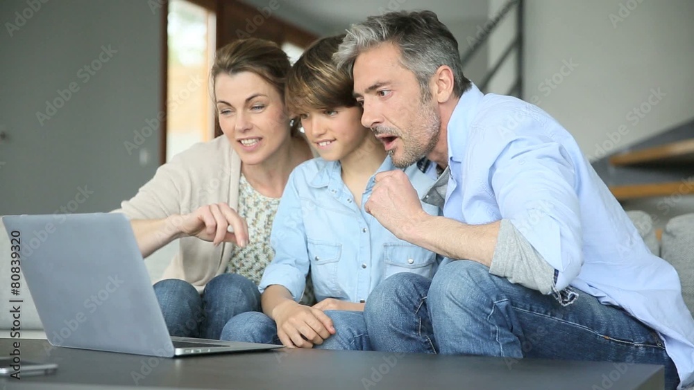 Happy family of three waving at camera during video call Happy family of three waving at camera during video call