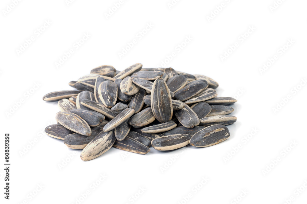 sunflower seeds pile against white background sunflower seeds pile against white background