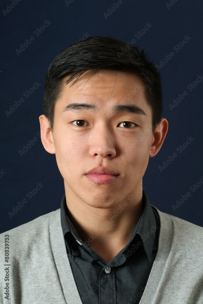 Obraz premium Young Asian man looking at camera