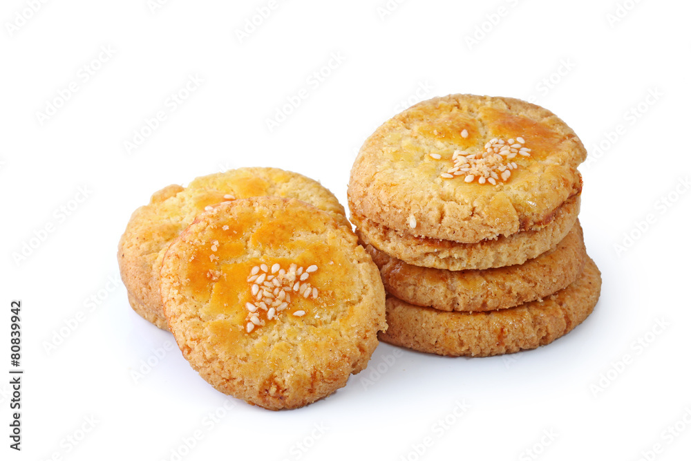 Sweet cookies with sesame seeds isolated on white background