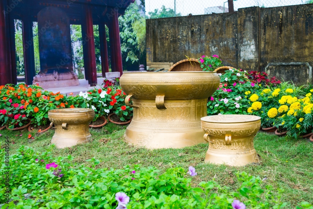 material bronze drums on grass in vietnames