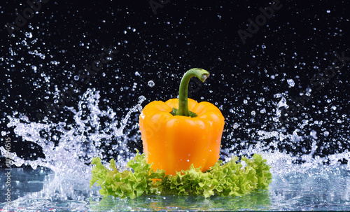 yellow pepper on salad with water splash