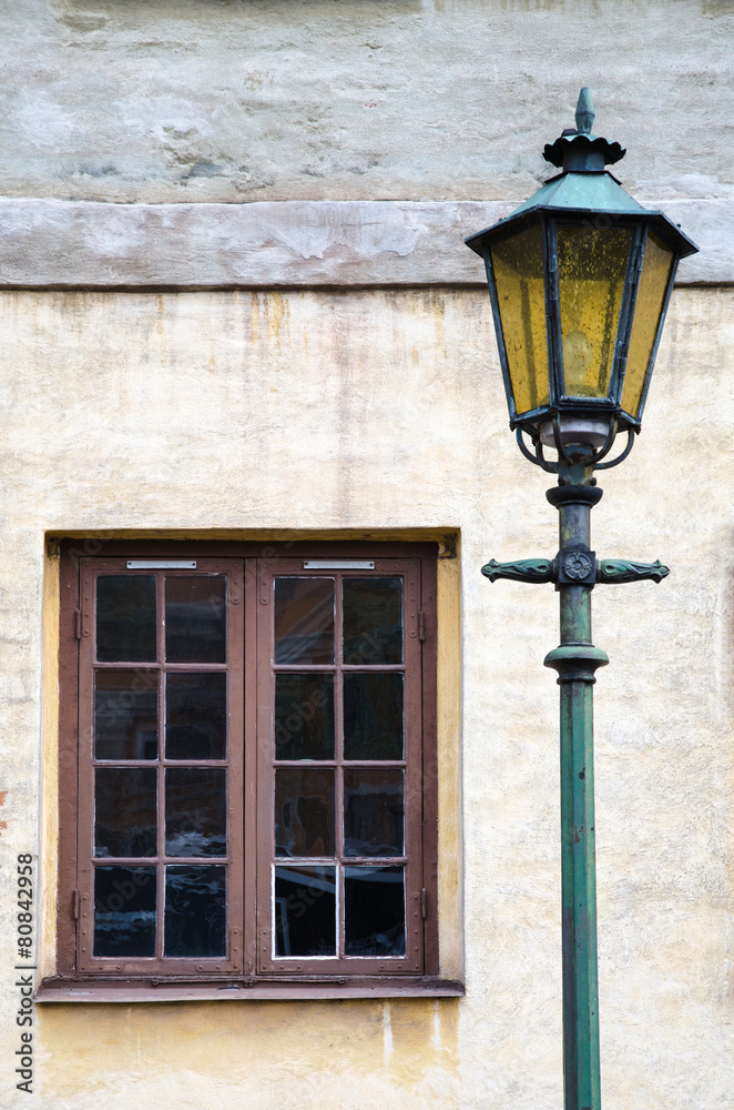 Old lamp at an old facade