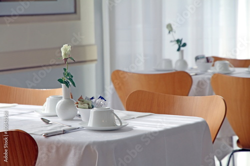 Table for breakfast in white