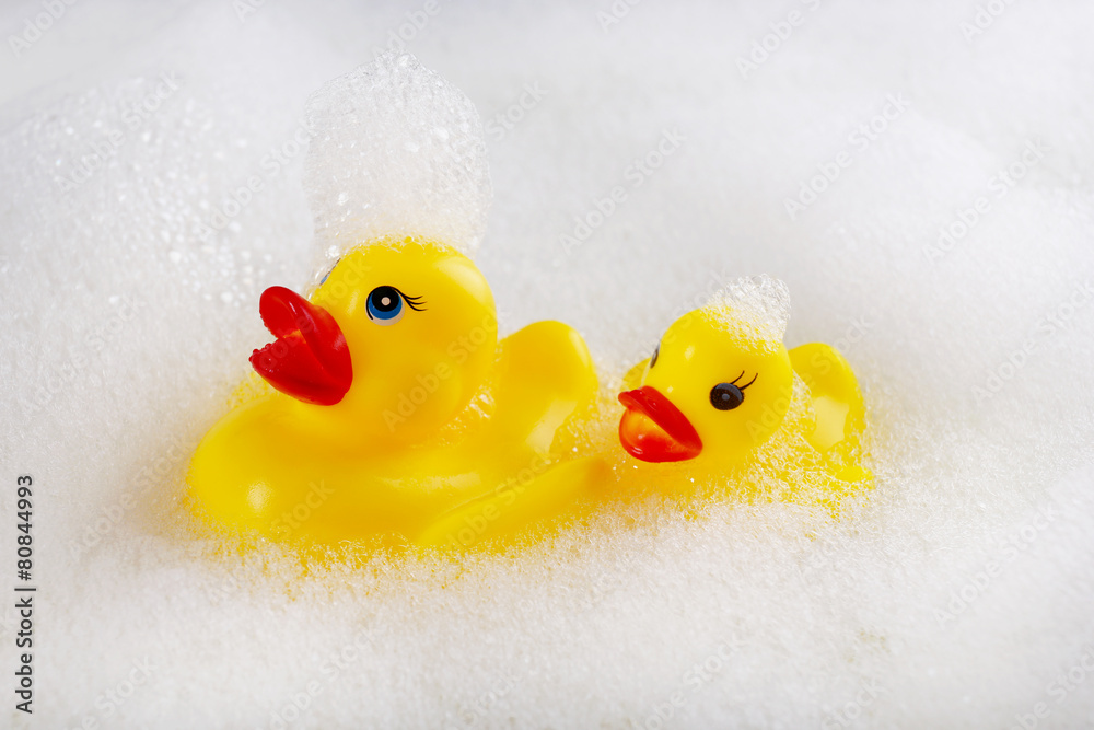 Rubber ducks in foam close-up Rubber ducks in foam close-up