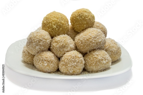 Sweet coconut balls on plate