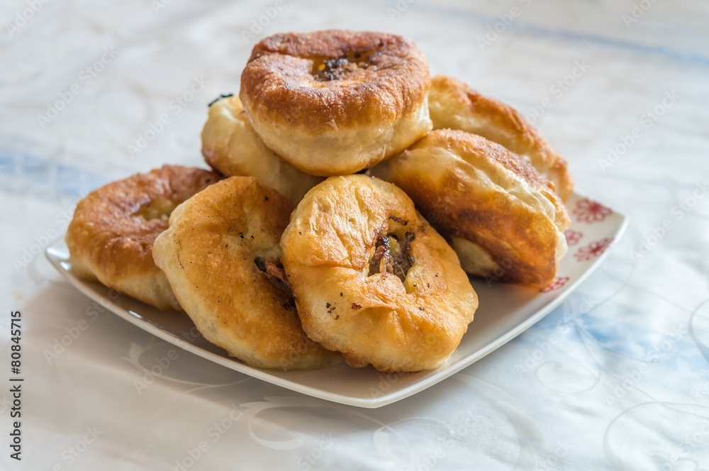 Belyashi - turkmenian pastry with meat on plate