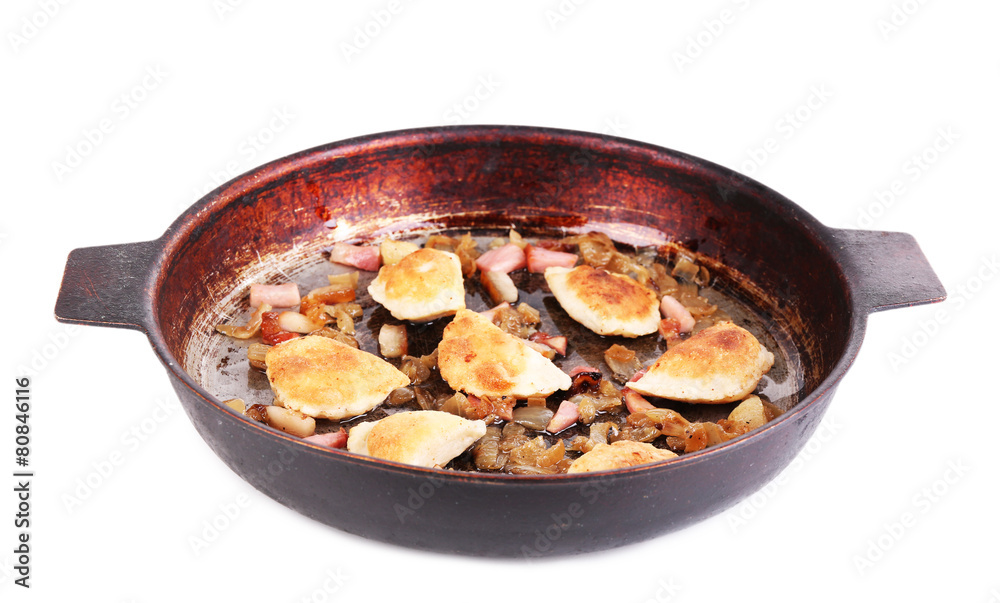 Fried dumplings with onion and bacon in frying pan, isolated Fried dumplings with onion and bacon in frying pan, isolated