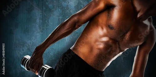 Mid section of fit shirtless young man liftin photo