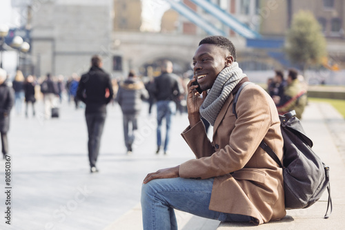 Black man talking on mobile phone in London