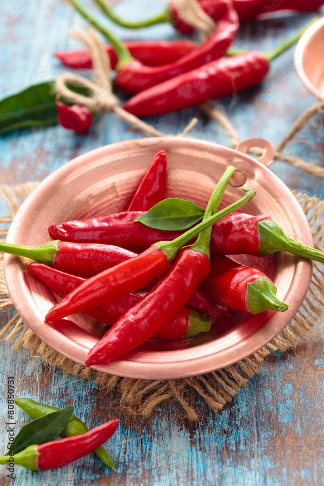 Chili peppers in a copper pot. Chili peppers in a copper pot.