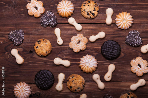 Various cookies on the wooden table