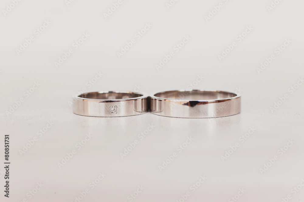 Golden wedding rings on white background. Jewelry Golden wedding rings on white background. Jewelry