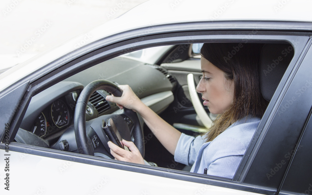 Woman at the telephone in the car Woman at the telephone in the car