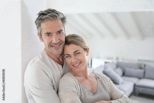 Portrait of mature couple relaxing at home © goodluz