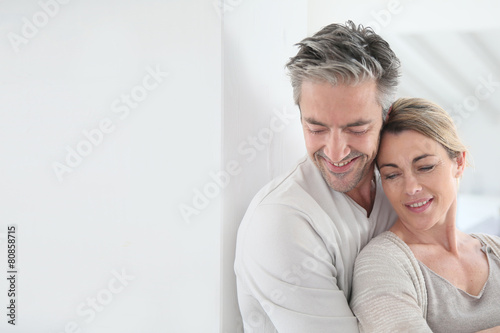 Portrait of mature couple embracing each other © goodluz