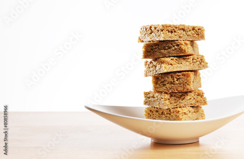Home made gluten free flapjack on a curved dish photo