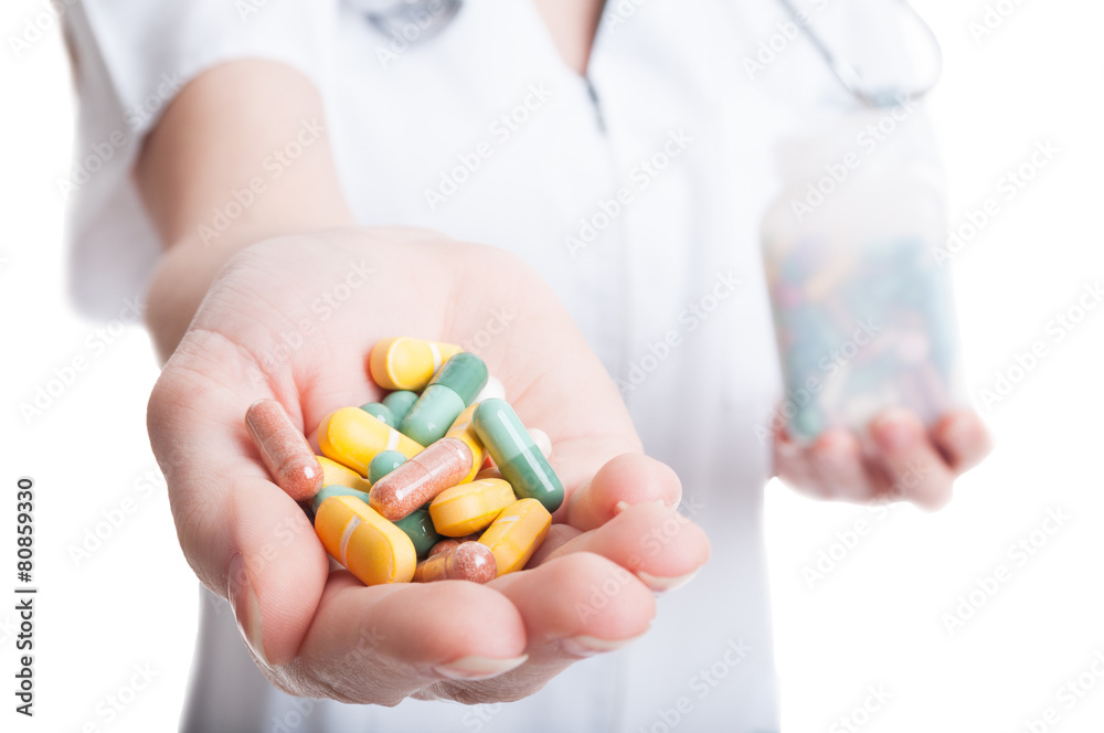 Closeup with woman hand holding natural pills and vitamins Closeup with woman hand holding natural pills and vitamins
